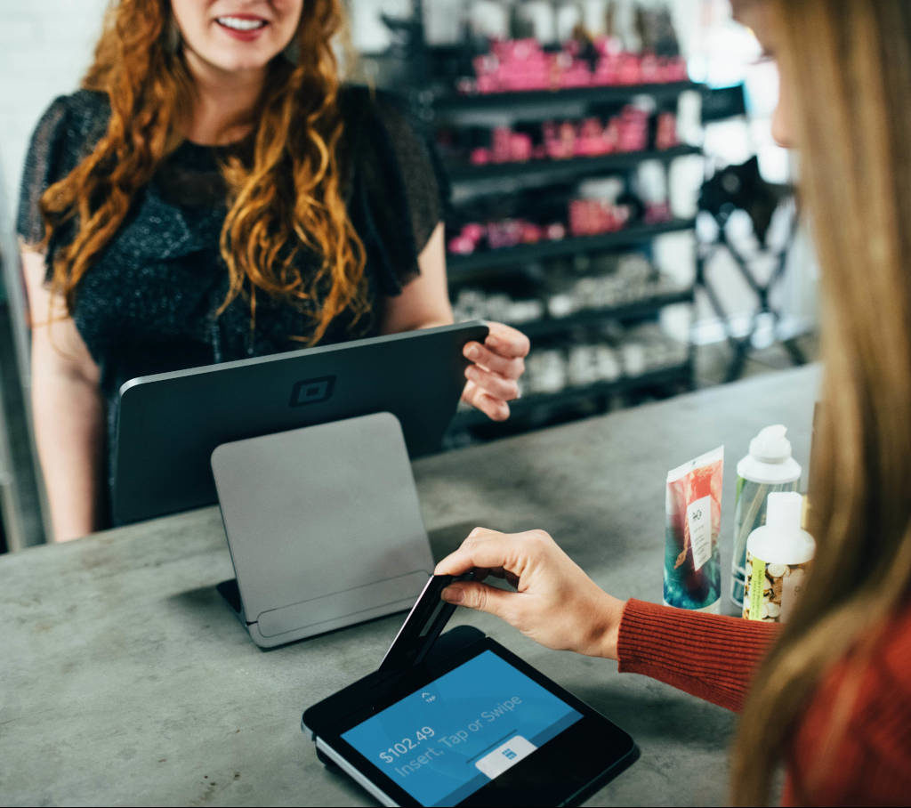 Customer paying at kiosk